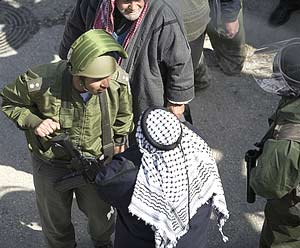Isreali soldier and Palestinian man