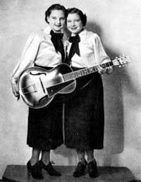 Photo of Cackle Sisters and guitar