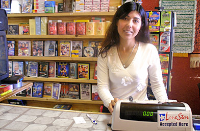 Mariya Sher Ali behind the counter of her store, Amarillo International Foods.