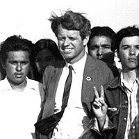 Robert Kennedy with Chicano activist Harry Gamboa flashing a peace sign