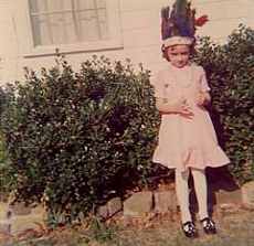 Sarah as a child in Indian headdress