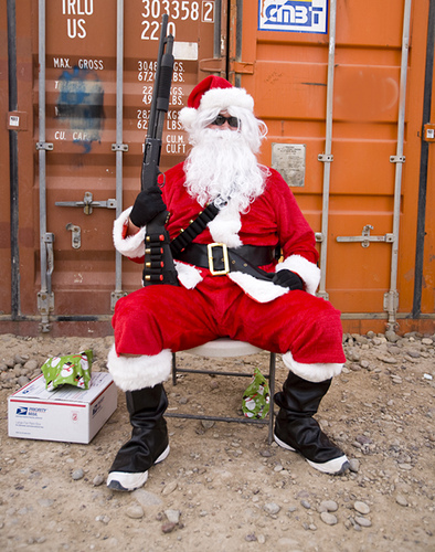 Santa with shotgun defending his gifts. He's serious. 