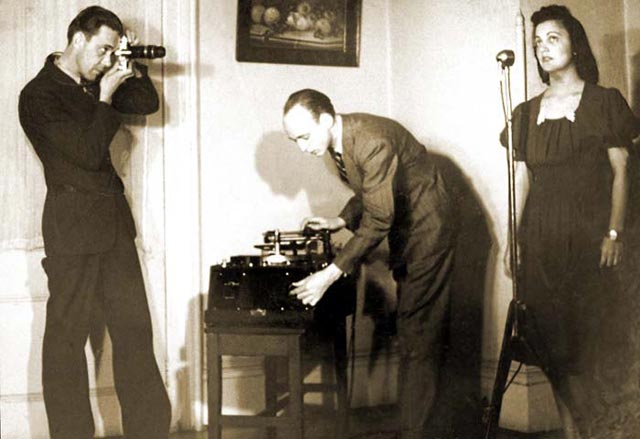 Robert Cook (with camera) and Stetson Kennedy (with recording equipment) documenting Edith Ogden-Aguilar Kennedy, Ybor City, 1939