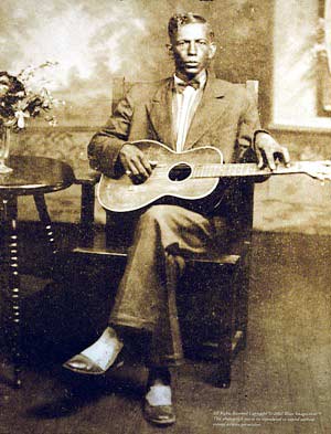 Charley Patton and guitar
