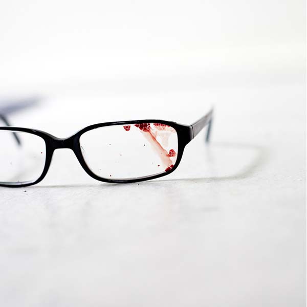 Jake's eyeglasses with blood on them