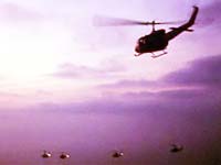 UH1 Helicopters flying in Vietnam at sunrise