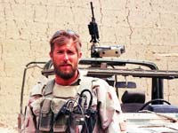 Sgt. Clint Douglas and armed Army jeep