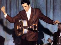 Elvis, with guitar and gyration, live at the Louisiana Hayride