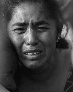 Paula Flores attends the burial of her daughter Sagrario Gonzalez, a maquiladora worker abducted and killed in April 1998.