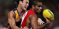 Two players battle for the ball