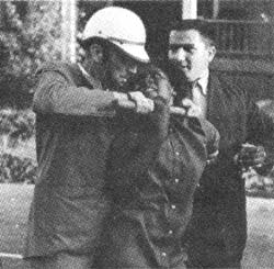 Policeman assaulting a woman