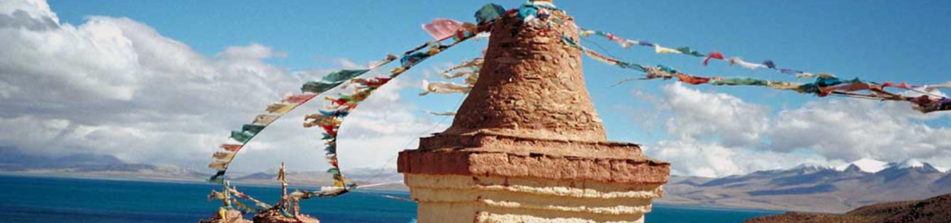 Prayer flags and monument on the mountain