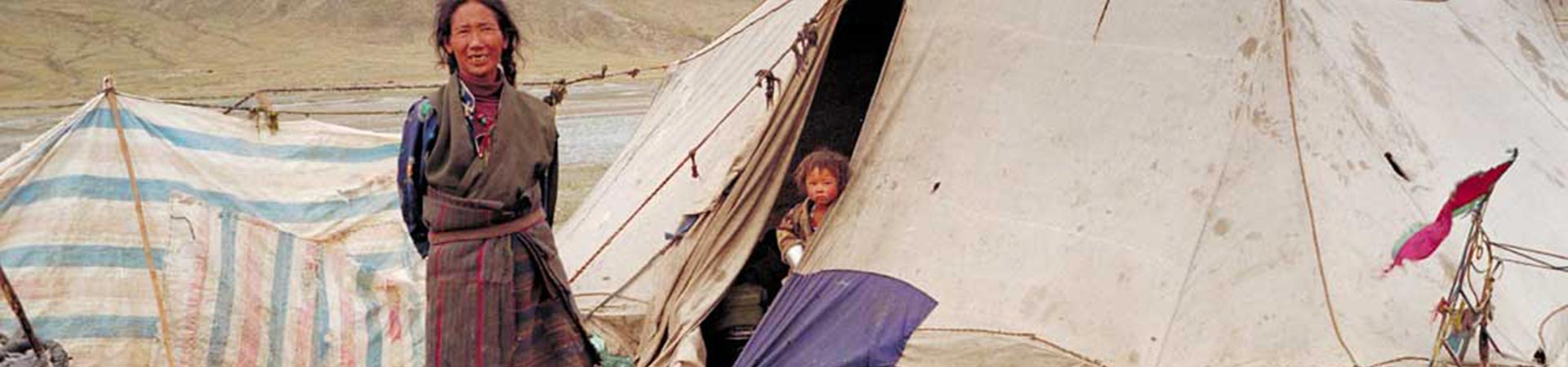 Mother and son in their tent home