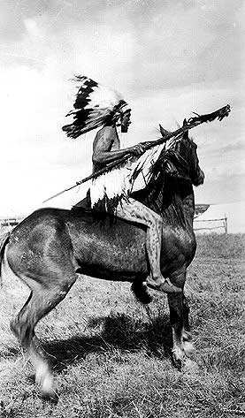 Crow Man preparing, for sham battle, 1912, Crow Agency, MT