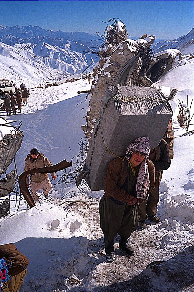 Carrying packs into Salang tunnel