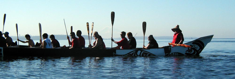 Native americans in canoe along the Tribal Journey route.