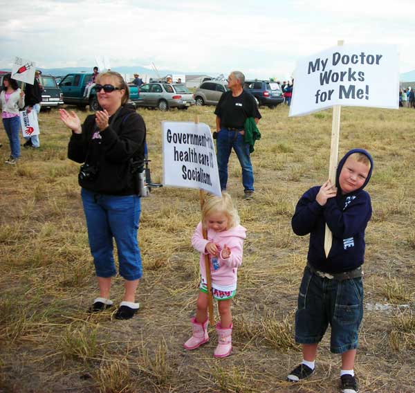 Kids with anti-socialism signs