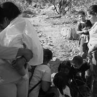 Women with children crossing desert