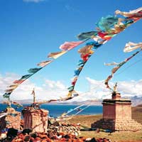 Prayer flags at alter on mountain, photo: Scott Carrier