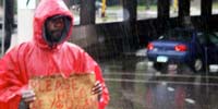 Homeless man in rain