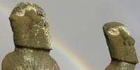 Moai stone heads with rainbow