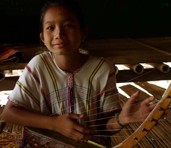 A Student learning to play the Thana in Mae La refugee camp