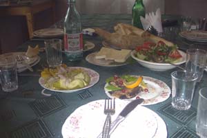 Breakfast: cheese, bread, tomatoes, cucumbers, eggplant, and Borjomi, the world's best bottled water